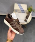 brown Adidas Superstar sneakers