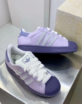 Adidas Originals Superstar in a purple colorway.