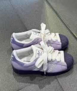Adidas Originals Superstar in a purple colorway.