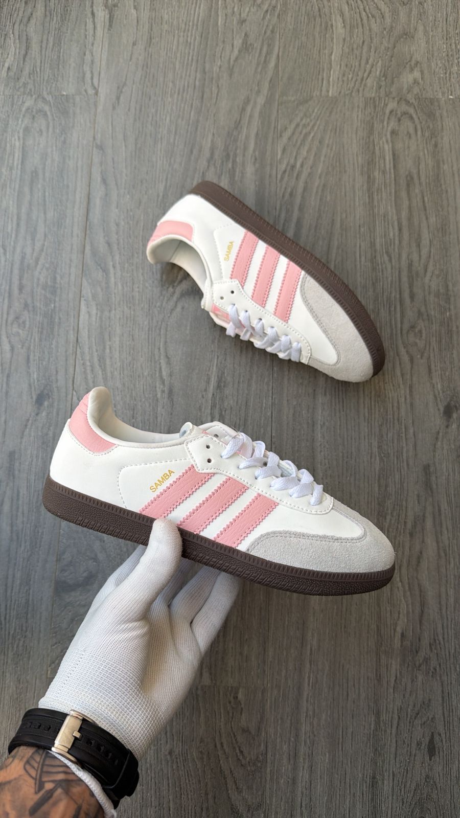 Adidas samba white with pink stripes.