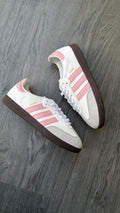 Adidas samba white with pink stripes.