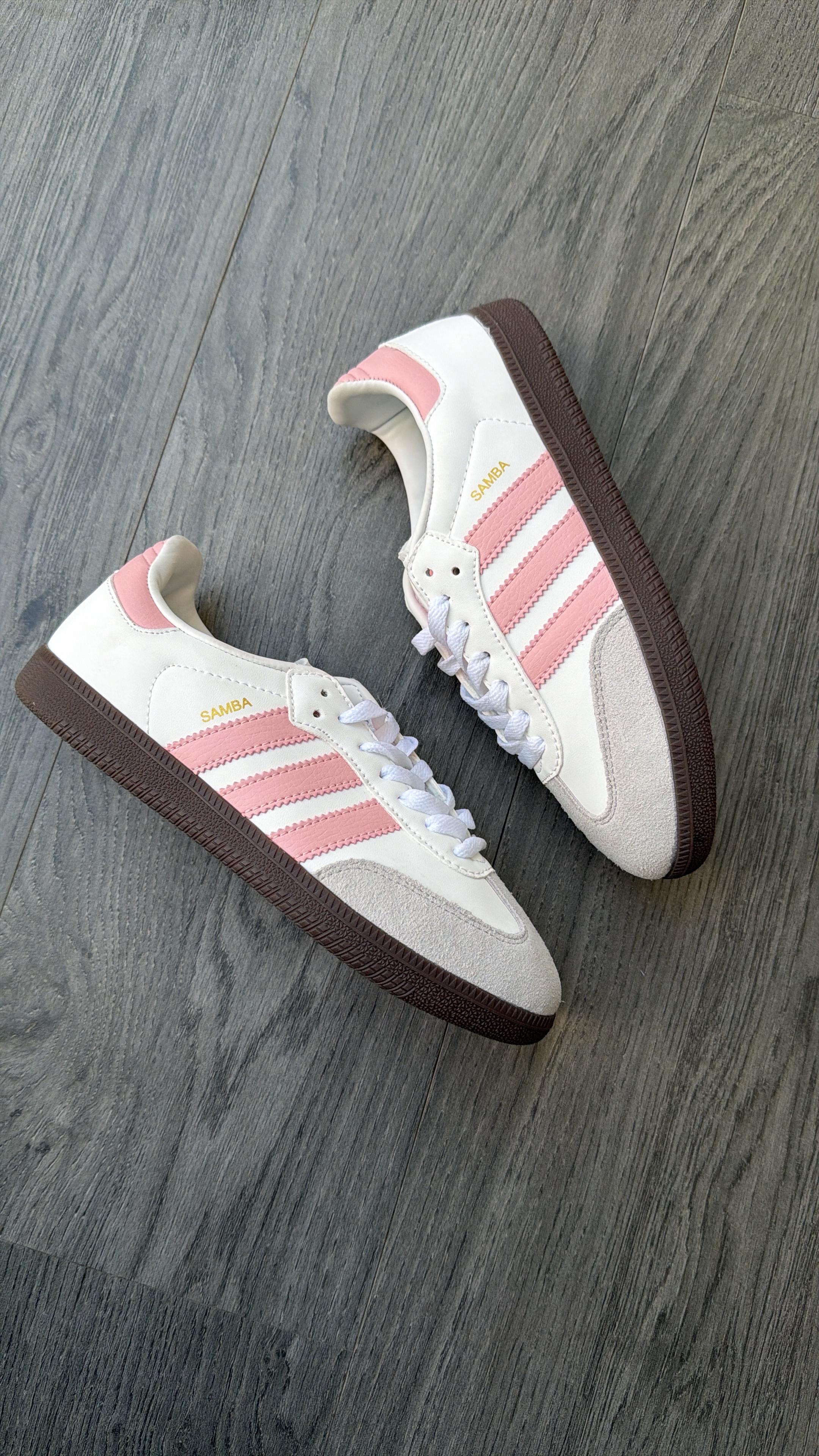 Adidas samba white with pink stripes.